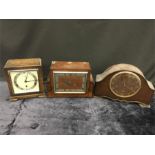 Three vintage wooden Art Deco style mantle clocks.