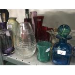 A collection of large glass vases and decanters.