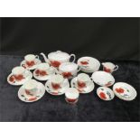 A large Wedgwood Susie Cooper design teaset "Cornpoppy", 1 cup missing.