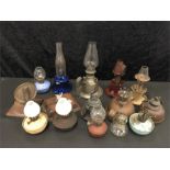 A collection of various small oil lamps.