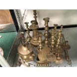 A large quantity of brass including several candelabras.