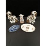 A pair of Staffordshire dogs together with a lamp base modelled as a cat with a ball and two