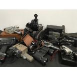 A collection of eight vintage cine film camcorders including one digital together with binoculars