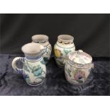 Four large pieces of Honiton Pottery to include two vases, a jug and a lidded pot.