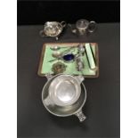 A mixed lot of silver plated items to include a part dressing table set, grape scissors and cream