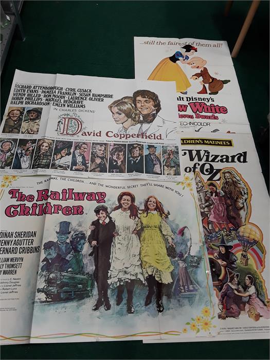 Four film posters. Snow White, Wizard of Oz, Railway Children and David Copperfield.