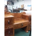 A two pillared dressing table with central mirror.