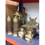 Various brass and metal candle holders.