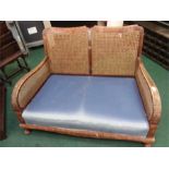 A Bergere two seater sofa.