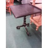 A black painted square occasional table resting on barley twist column to tripod base.