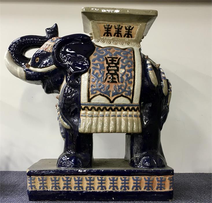 A ceramic elephant seat.