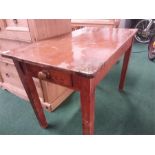 A pine kitchen table with single drawer to front.