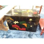 A black lacquered Chinese design storage chest.