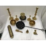 Various brass and iron items to include candlesticks, bowls and a string box.