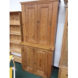 A large pitch pine dresser of two cupboards.