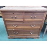 A mahogany chest of four drawers resting on plinth base.