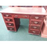 A mahogany twin pedestal desk on castors.