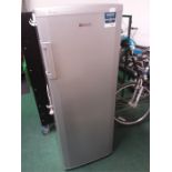 A Beko upright fridge in silver.