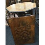 An octagonal top occasional table in oak together with a games table top.