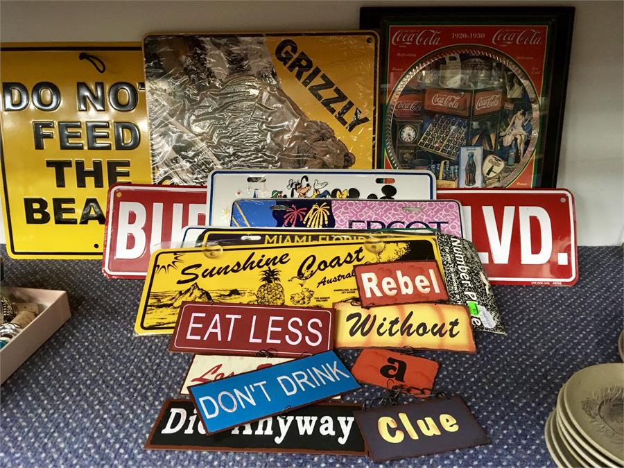 Tin road signs, American registration plates and other items.
