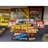 Tin road signs, American registration plates and other items.