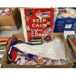 A box of English bunting together with fridge magnets and other items.