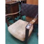 An oak leather backed bedroom armchair.