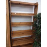 A five tier modern pine open bookcase.