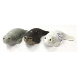 Poole Pottery baby seals designed by Barbara Linley Adams, two in trial glaze, and one for the world