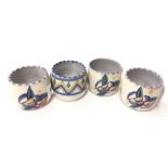 Poole Pottery four shape 713 egg cups, three AQ pattern, one LD pattern.