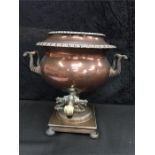 A part copper Samovar with twin handles and a square base with decorative engraving.(13.5" high).