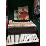 A Vintage large piano accordion in case.