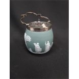 A Wedgwood sage green biscuit barrel, date marked 1894 with silver plated lid and handle.