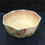 A Bizarre bowl by Clarice Cliff decorated with flowers in blue yellow green etc. (hair crack).