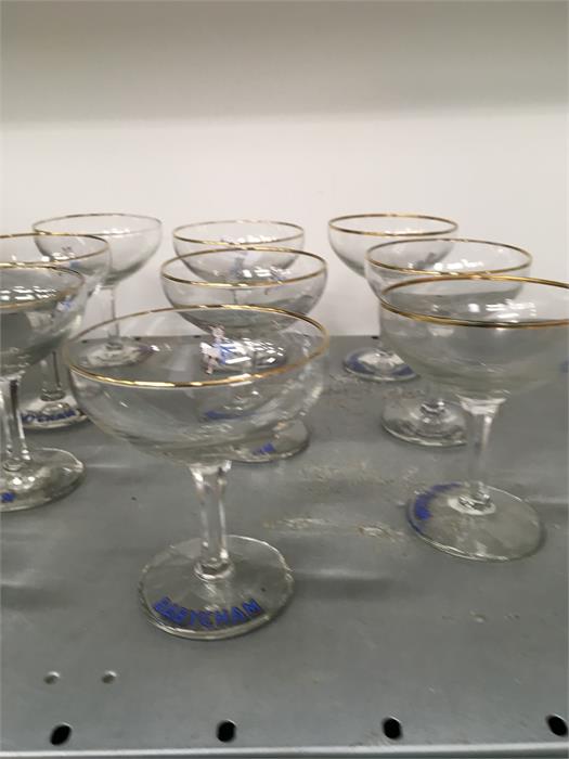 A set of 10 Babycham glasses.