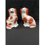 Two Staffordshire dogs 9" high.