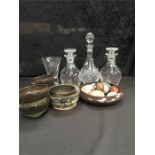 Three modern glass decanters and a vase together with seven pieces of pottery and a collection of