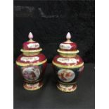 A pair of Vienna style lidded urns with decorative cartouches. 8.5" high.