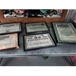 Five vintage American shares in frames to include Pennsylvania Railroad Company, Lake Shore Le
