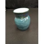 A 1930's Broadstone Pottery vase with blue glaze (4.5" high).