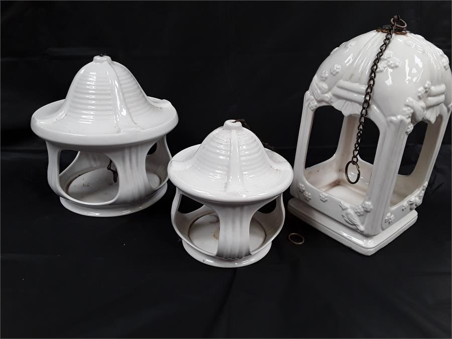 Three ceramic hanging lanterns.