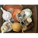 A large box of various chinaware.