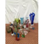 A large quantity of coloured glass including animals and vases.