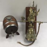 A decorative brass bell and a Brandy barrel.