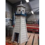 A garden lighthouse with battery powered light fitment.