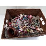 A basket containing a quantity of costume jewellery.