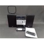 A Sony CMT-FX300i Micro Hi-Fi Component System. Radio, CD, Aux and IPod. Comes with remote,