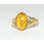 A 9 carat gold ladies' amber set rings, size N.