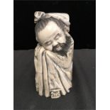 Mammoth Ivory: A study of a sleeping Lohan.(7" high).