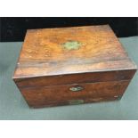 A 19th century mahogany sewing box and contents, with brass fittings.